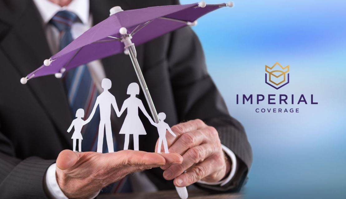 photo of paper cut out family under an umbrella